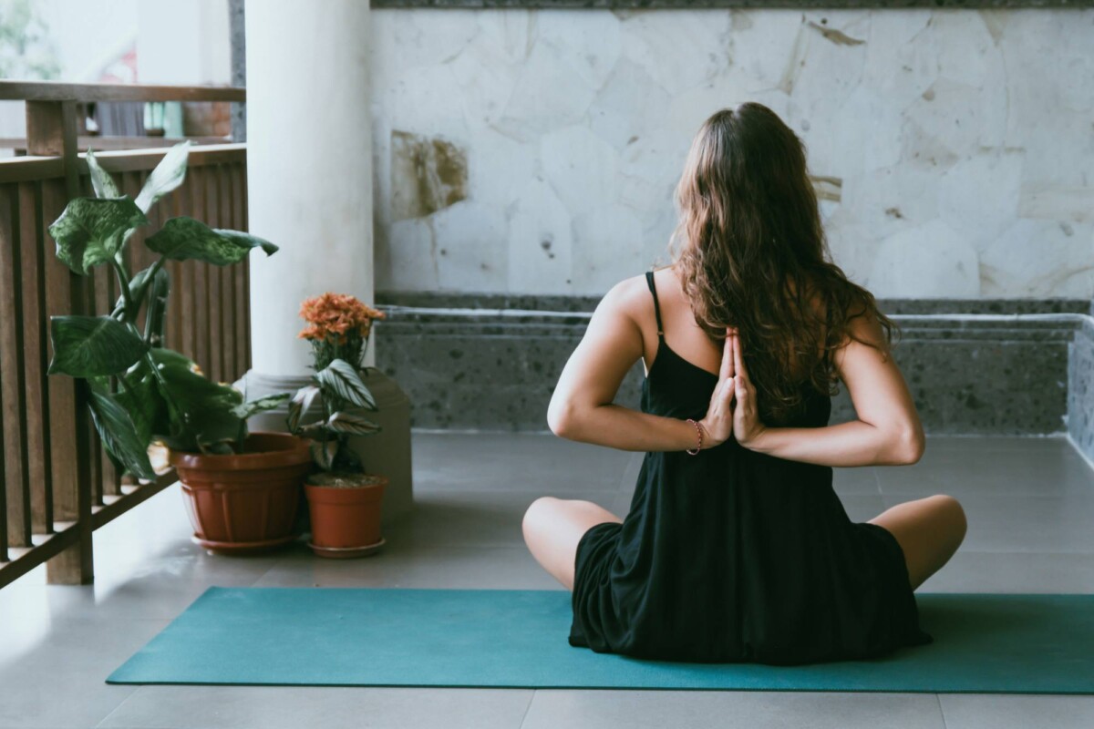 woman doing yoga in a serene setting